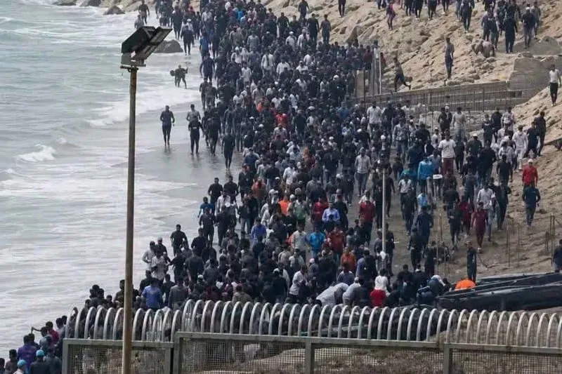 Mass Exodus from Morocco: Thousands Flee to Ceuta Amidst Crisis