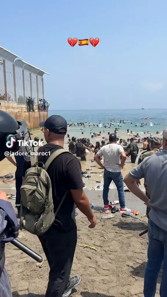 Escalating Tensions: Moroccan Police and Migrants at Ceuta Border