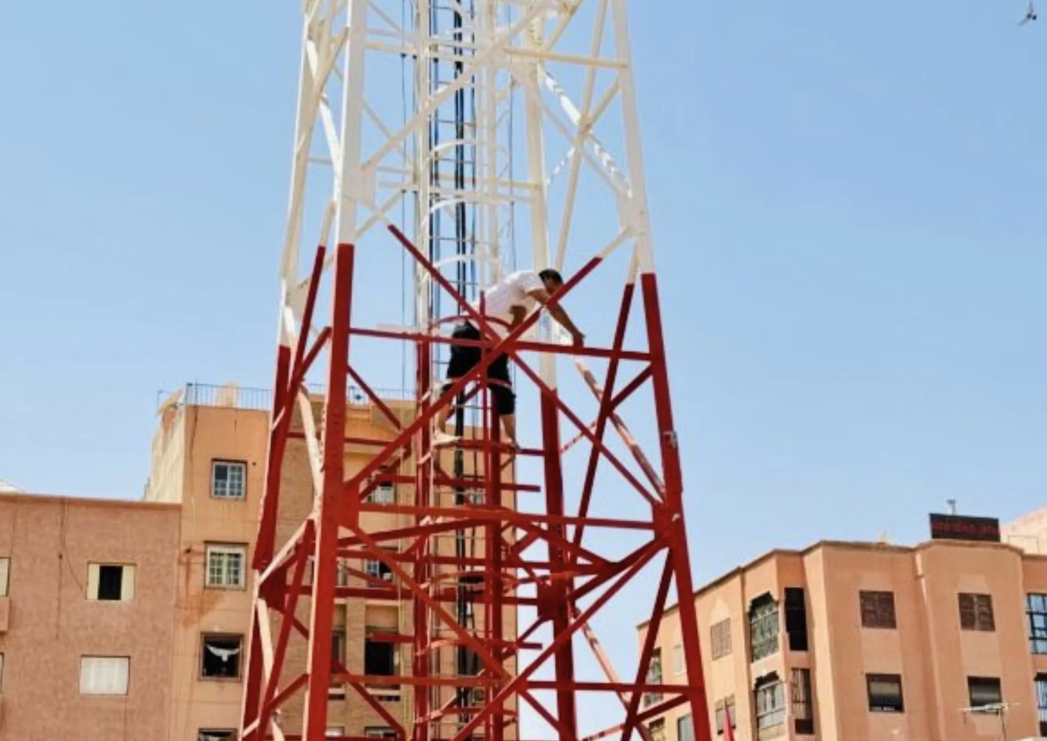 Street Vendor's Desperate Protest in Marrakech: Climbing to New Heights